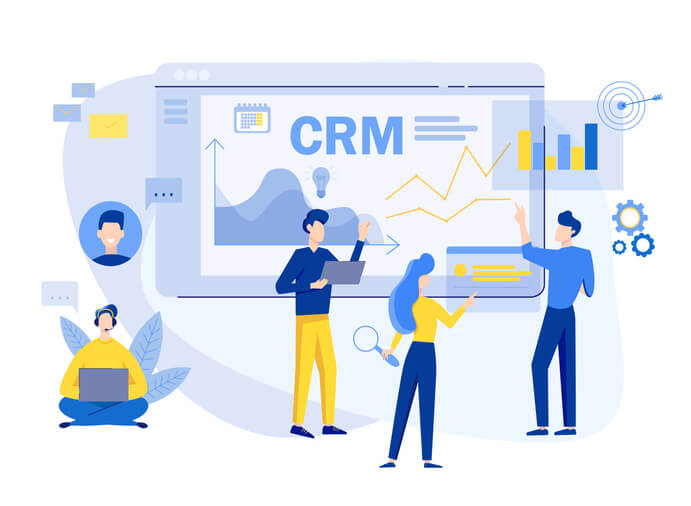 A group of people looking at different aspects of customer data and performance in the best CRM for small business owners.