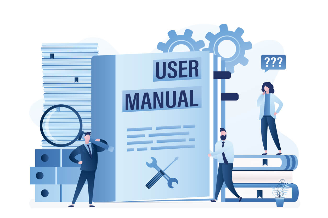 Three people gather around a large book that says User Manual.