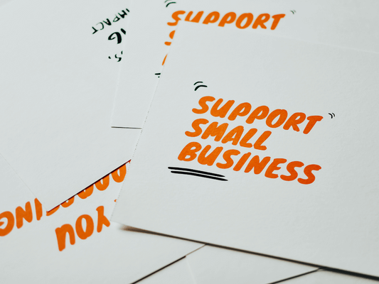 Card stock that says "Support Small Business".